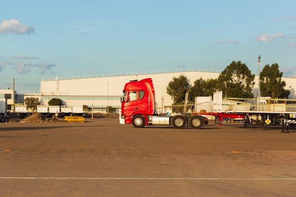 Truck and trailers parked on an outdoor storage lot